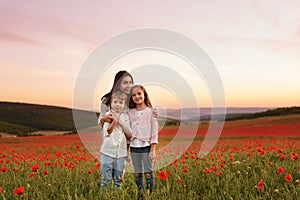 Family in the field of poppies