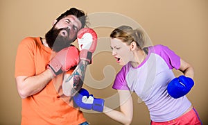 Family fight. knockout and energy. couple training in boxing gloves. training with coach. Happy woman and bearded man
