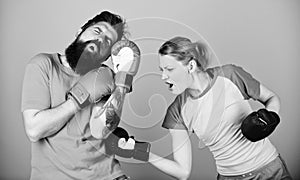 Family fight. knockout and energy. couple training in boxing gloves. training with coach. Happy woman and bearded man