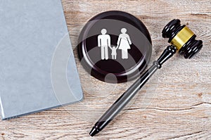 Family figure and gavel on table. Family law concept