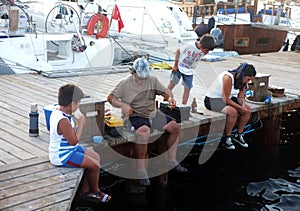 Family fishing on jetty