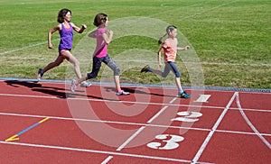 Family fitness, mother and kids running on stadium track, training and children sport healthy lifestyle