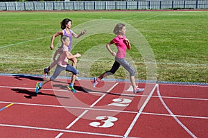 Family fitness, mother and kids running on stadium track, training and children sport healthy lifestyle