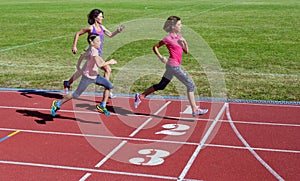 Family fitness, mother and kids running on stadium track, training and children sport healthy lifestyle