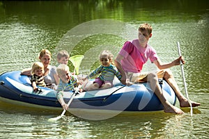 Family float on an inflatable boat and fish net.