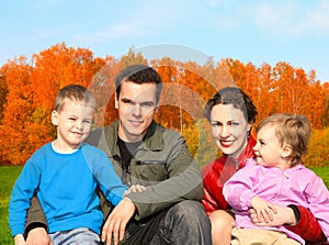 Family of four in autumnal park collage