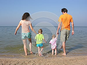 Family of four on beach