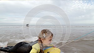 Family of four body boarding in the sea