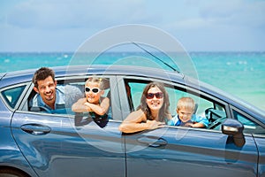 Family of four driving in a car