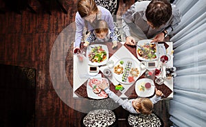 Family of four having meal at a restaurant