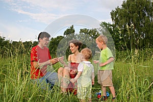 Family of four on meadow