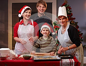Family of four preparing for christmas