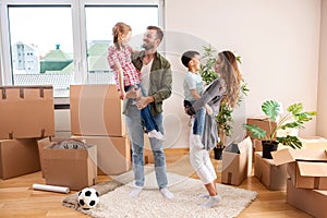 Family of four in their new apartment