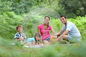 Family of fourv having a picnic