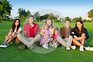 Family friends group people sitting green grass