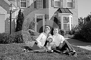 Family in Front of Their Home