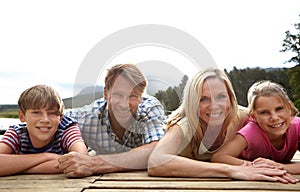 Family fun day. Portrait of a loving family spending time together in nature.