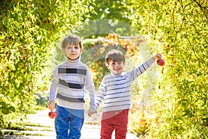 Family fun during harvest time on a farm. Kids playing in autumn