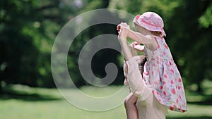 Family Fun. Mother And Daughter Playing And Laughing In Park