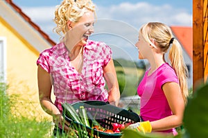 Family at gardening in front of their home