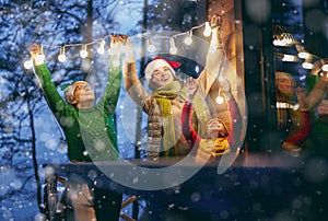 Family with garlands outside