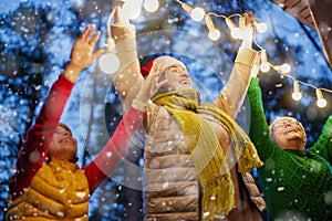 Family with garlands outside