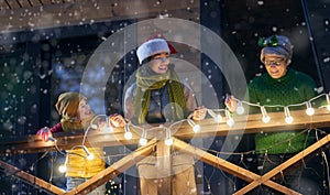 Family with garlands outside