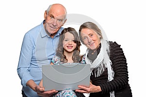 Family gathered around a notebook