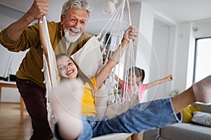 Family, generation love and people concept. Happy grandparent having fun with children at home