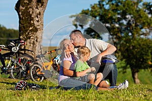 Family on getaway with bikes photo