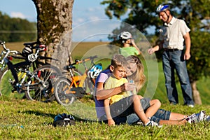 Family on getaway with bikes photo