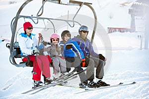 Family Getting Off Chair Lift On Holiday