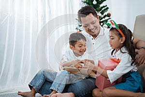 Family gift exchange during christmas photo