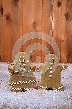 Family of Gingerbreads with 2 kids on Holiday Christmas Background