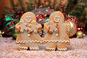 Family of Gingerbreads with 3 kids on Holiday Christmas Background