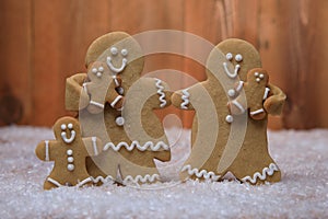 Family of Gingerbreads with 3 kids on Holiday Christmas Background