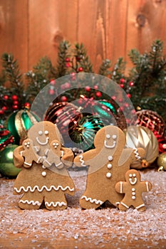 Family of Gingerbreads with 3 kids on Holiday Christmas Background