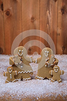 Family of Gingerbreads with 4 kids on Holiday Christmas Background