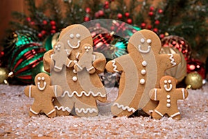 Family of Gingerbreads with 4 kids on Holiday Christmas Background