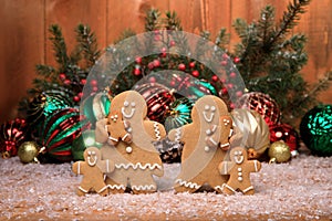 Family of Gingerbreads with 4 kids on Holiday Christmas Background