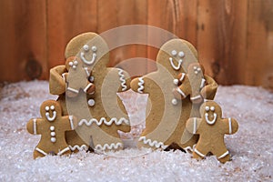 Family of Gingerbreads with 4 kids on Holiday Christmas Background