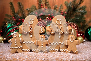 Family of Gingerbreads with 6 kids on Holiday Christmas Background