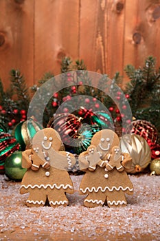 Family of Gingerbreads with kids on Holiday Christmas Background