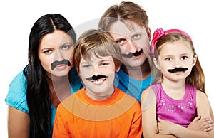 Family with glued artificial mustaches. photo