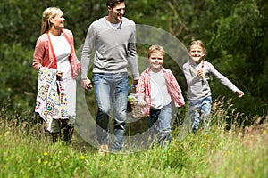 Family Going On Picnic In Countryside