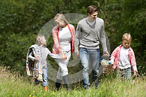 Family Going On Picnic In Countryside