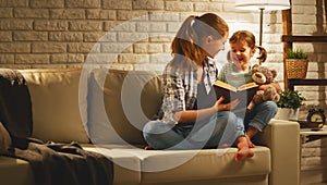 Family before going to bed mother reads to child daughter book n