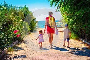 Family going to sea beach on summer vacation