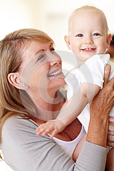 Family, grandma and baby in portrait with smile at home for visit, holiday or weekend in Australia. Happiness