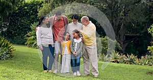 Family, grandparents and children outdoor at a park with love and care. Senior man and woman with young parents and